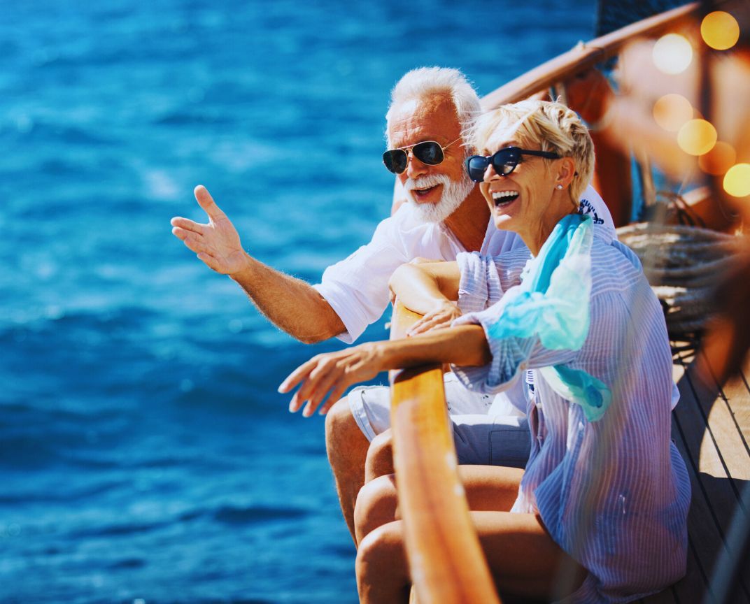 Financial Adviser South East Melbourne – elderly couple enjoying a boat trip together